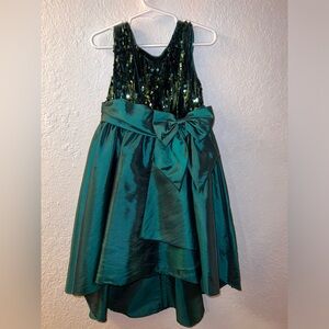 Beautiful high low emerald green dress with sequence on the top.